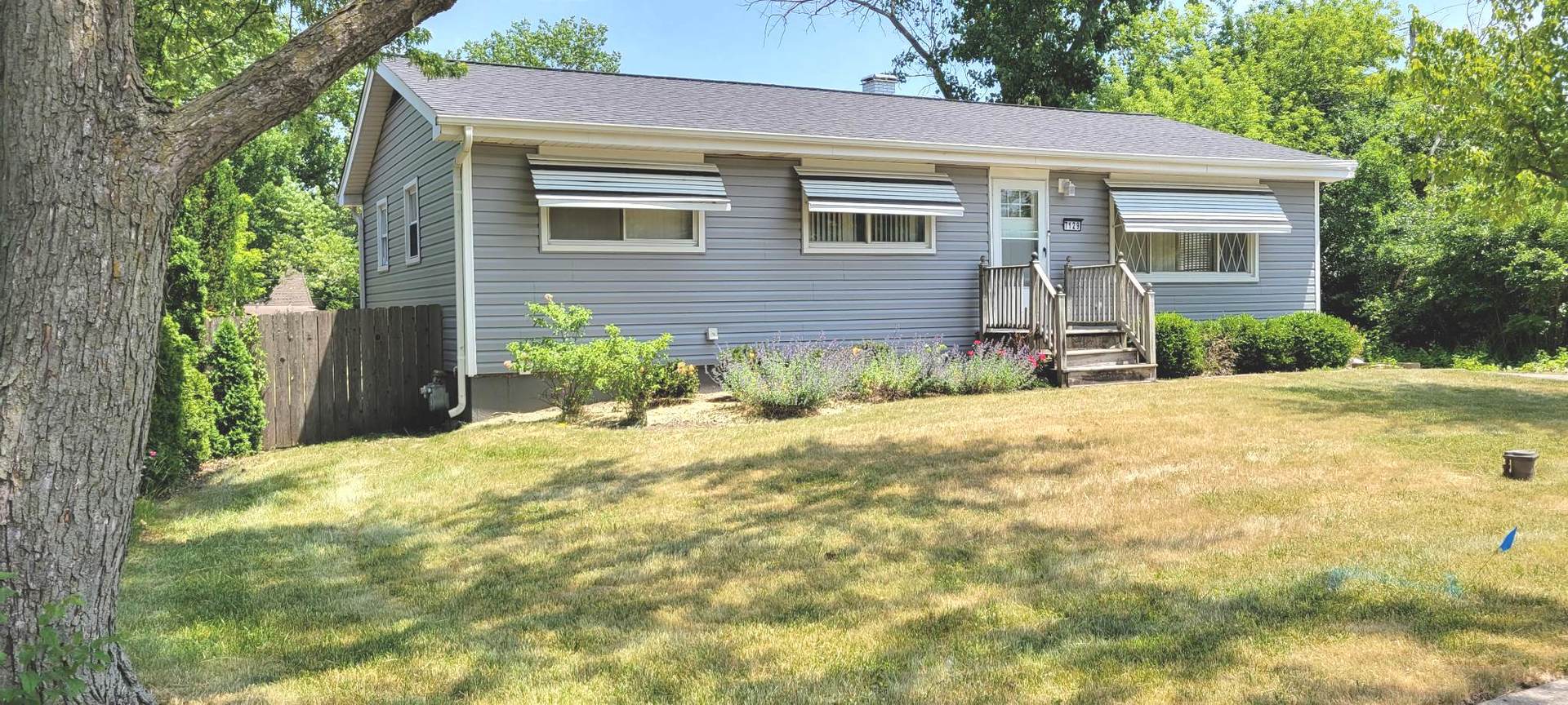 7129 Clarendon Hills Road Darien, IL 60561 - Photo 1 of 9 a front view of a house with a yard