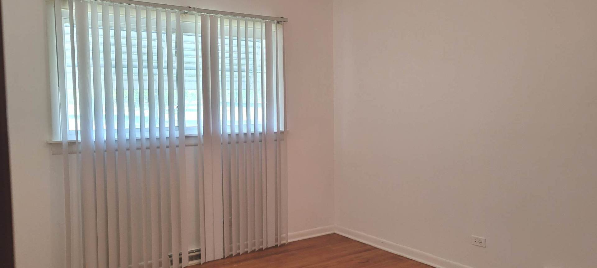 7129 Clarendon Hills Road Darien, IL 60561 - Photo 5 of 9 a view of an empty room with wooden floor