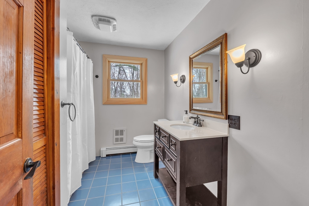 300 Padre Road New Braintree, MA 01531 - Photo 19 of 34 a bathroom with a sink and a mirror