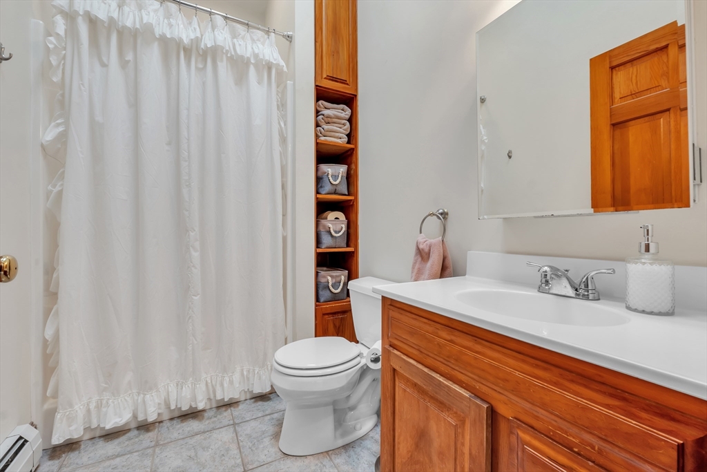 300 Padre Road New Braintree, MA 01531 - Photo 25 of 34 a bathroom with a sink a toilet and shower curtain