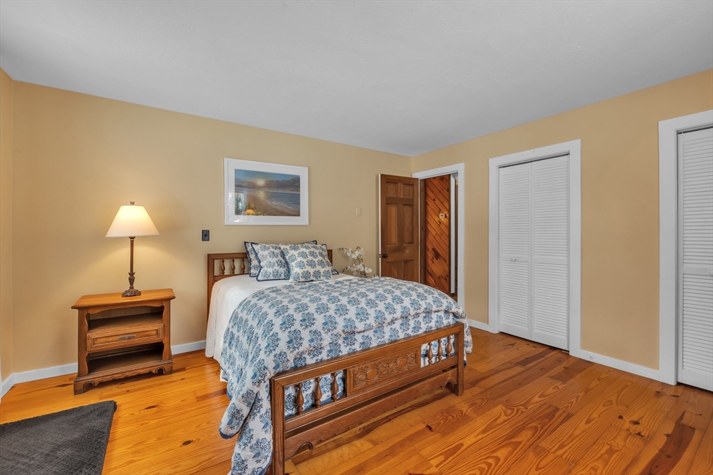 300 Padre Road New Braintree, MA 01531 - Photo 28 of 34 a bedroom with a bed and a lamp