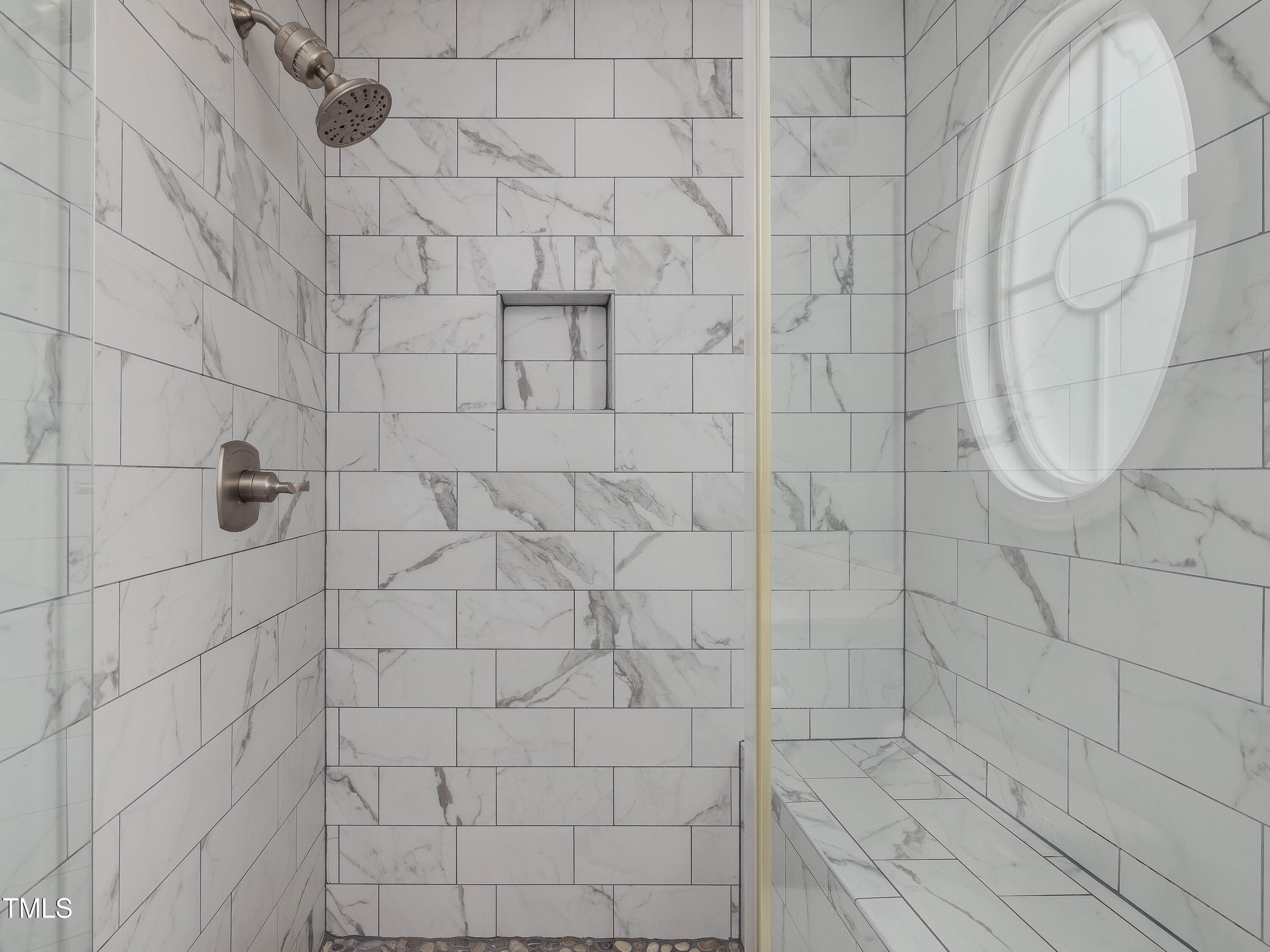 7661 Winners Edge Street Raleigh, NC 27617 - Photo 11 of 13 a bathroom with a shower