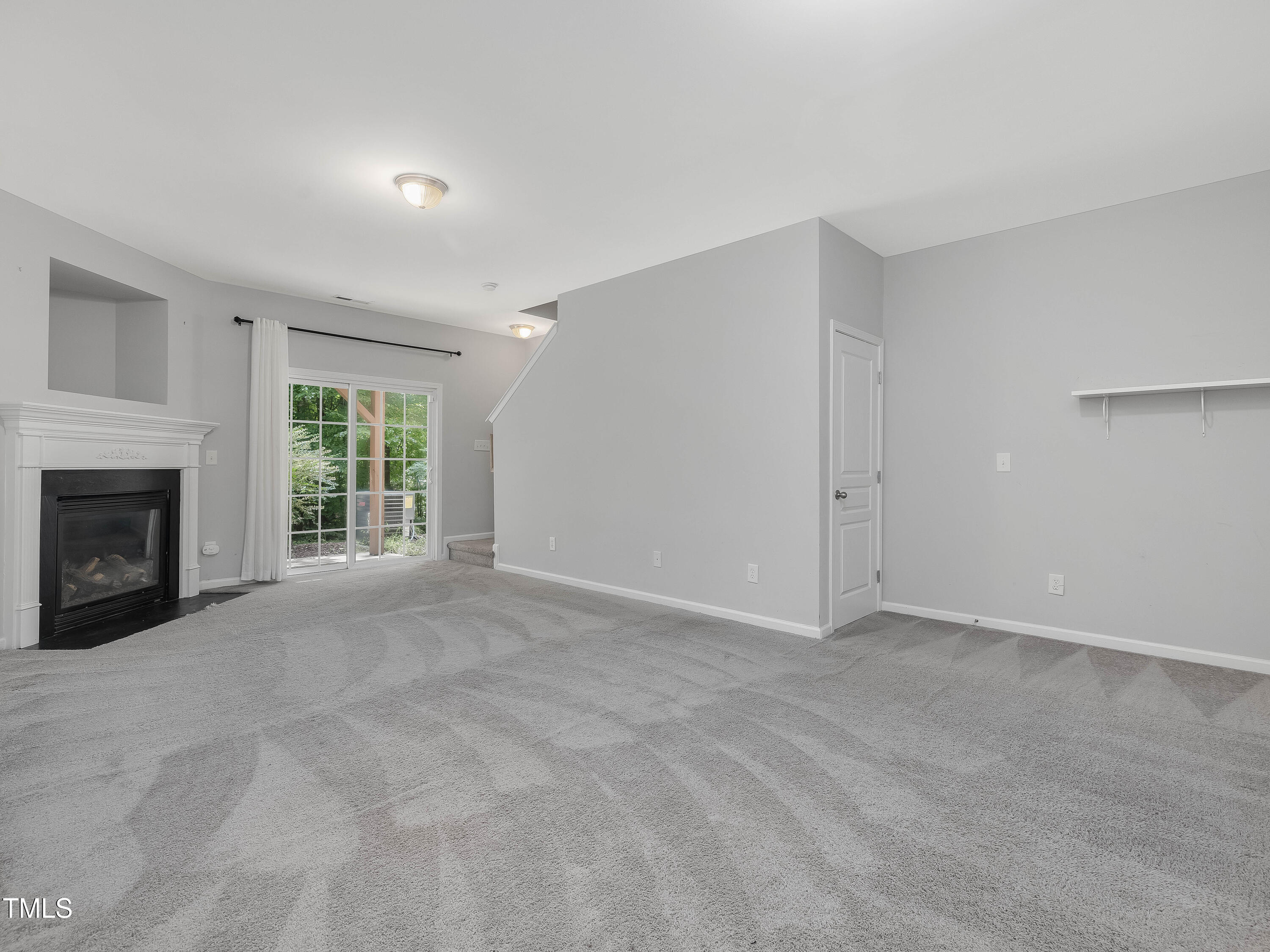 7661 Winners Edge Street Raleigh, NC 27617 - Photo 8 of 13 a view of an empty room with a window