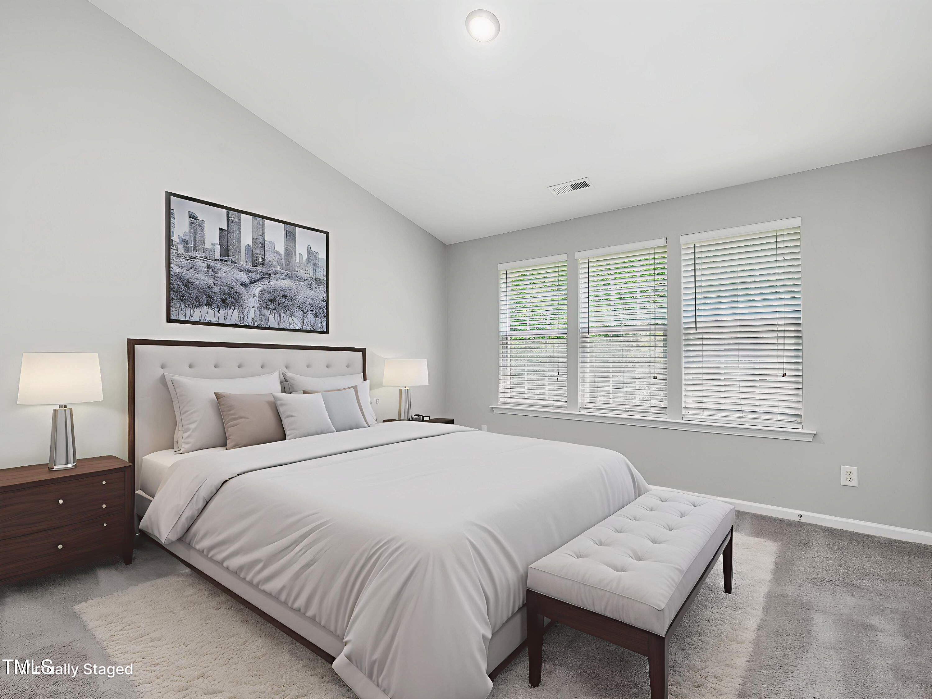 7661 Winners Edge Street Raleigh, NC 27617 - Photo 9 of 13 a bedroom with a bed and a couch