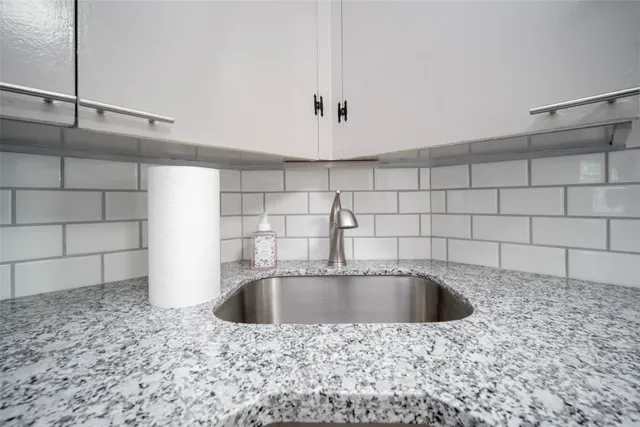 a bathroom with a sink a bathtub and shower