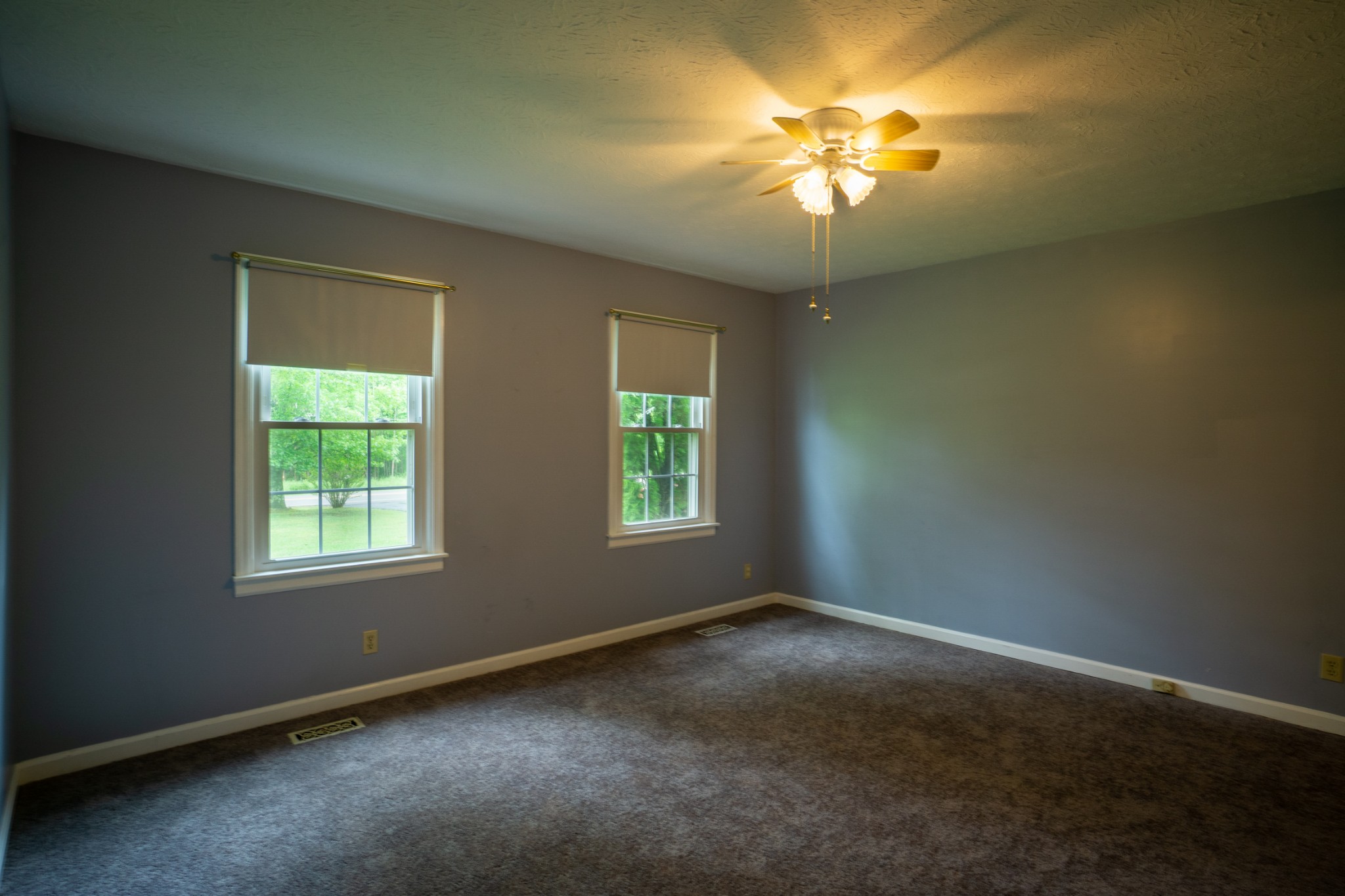 1035 Garton Road Burns, TN 37029 - Photo 12 of 31 a view of a livingroom with a chandelier fan and window