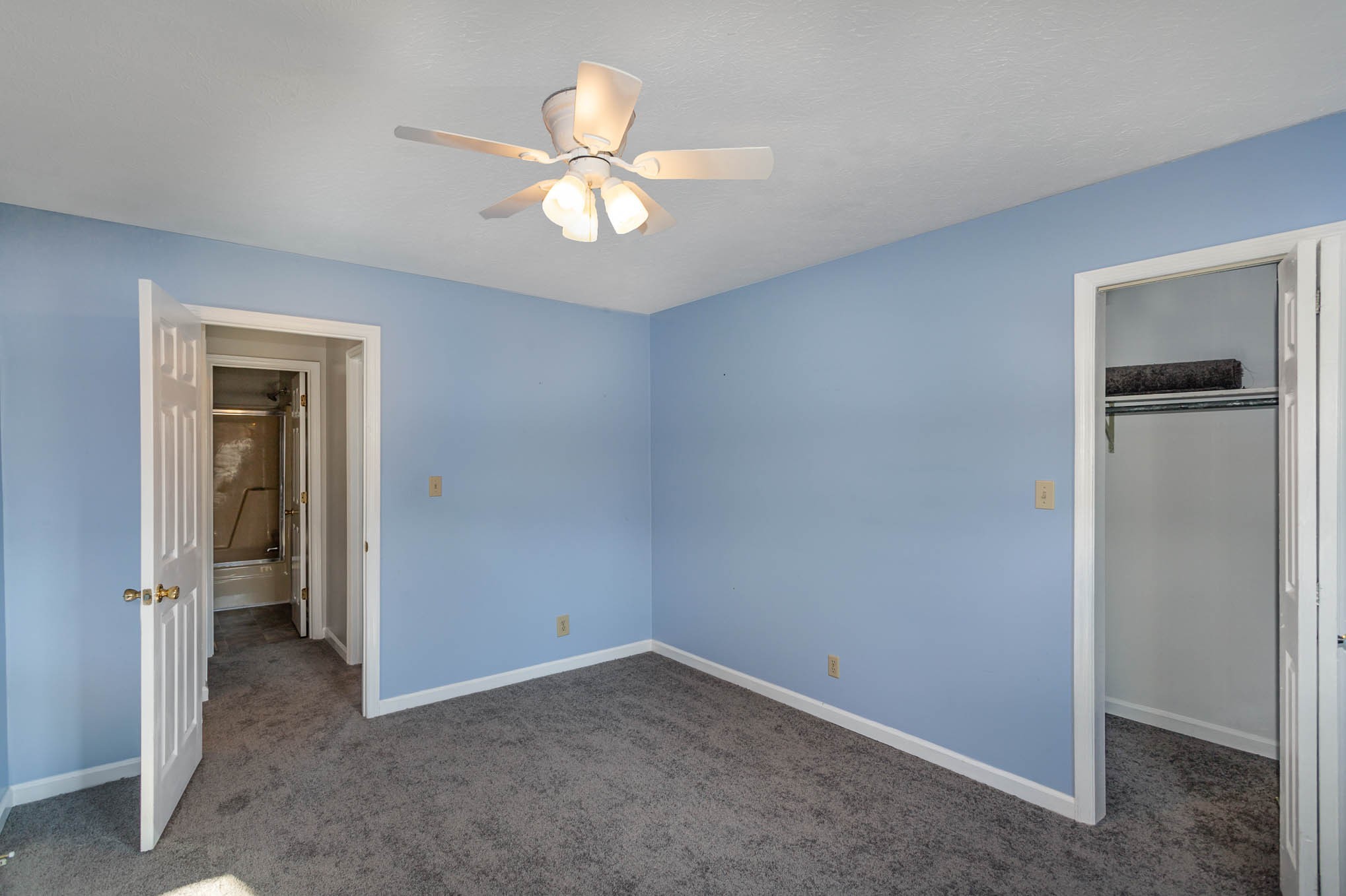 1035 Garton Road Burns, TN 37029 - Photo 19 of 31 an empty room with closet and a chandelier fan