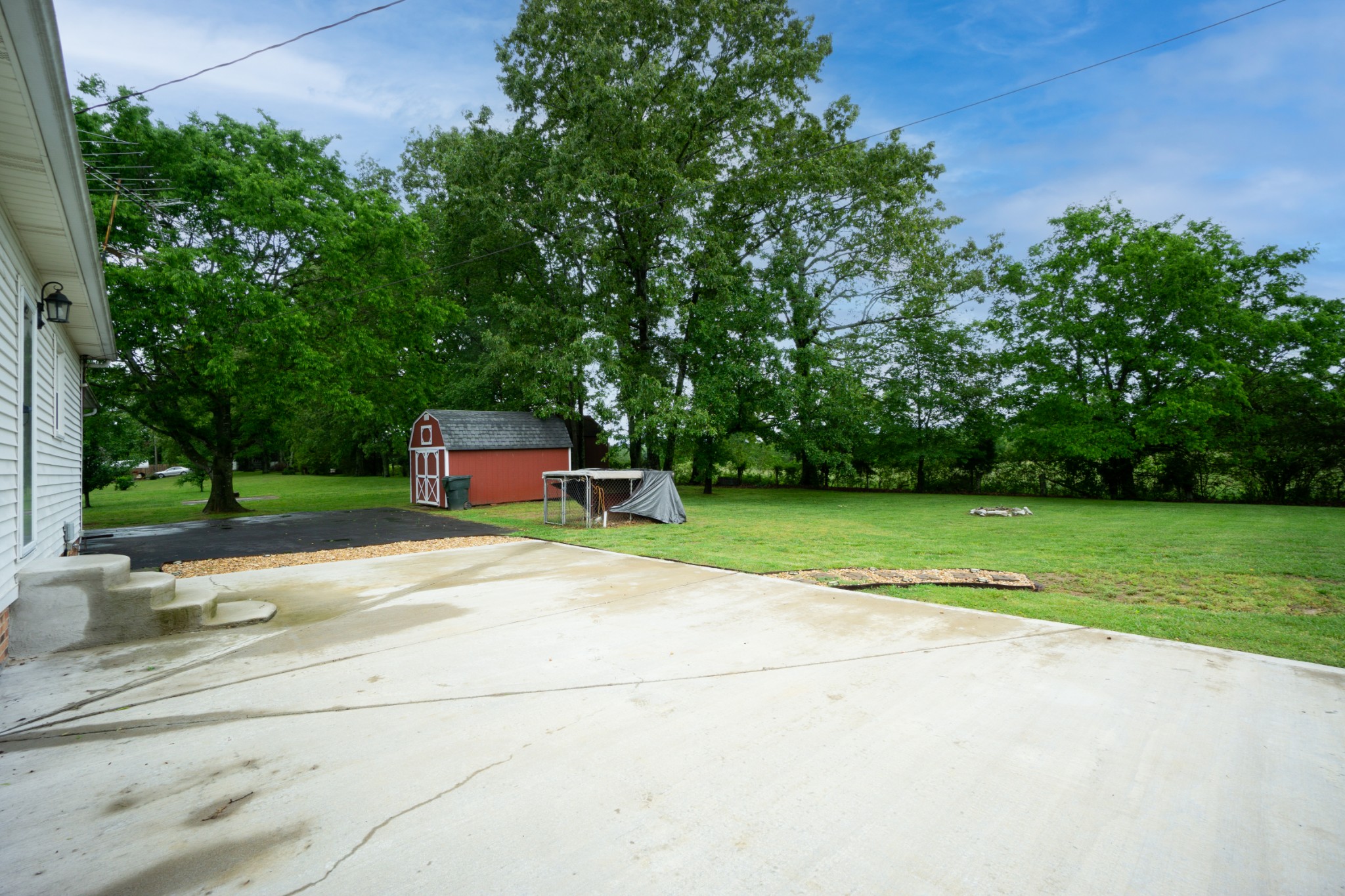 1035 Garton Road Burns, TN 37029 - Photo 27 of 31 a small garden covered with tall trees