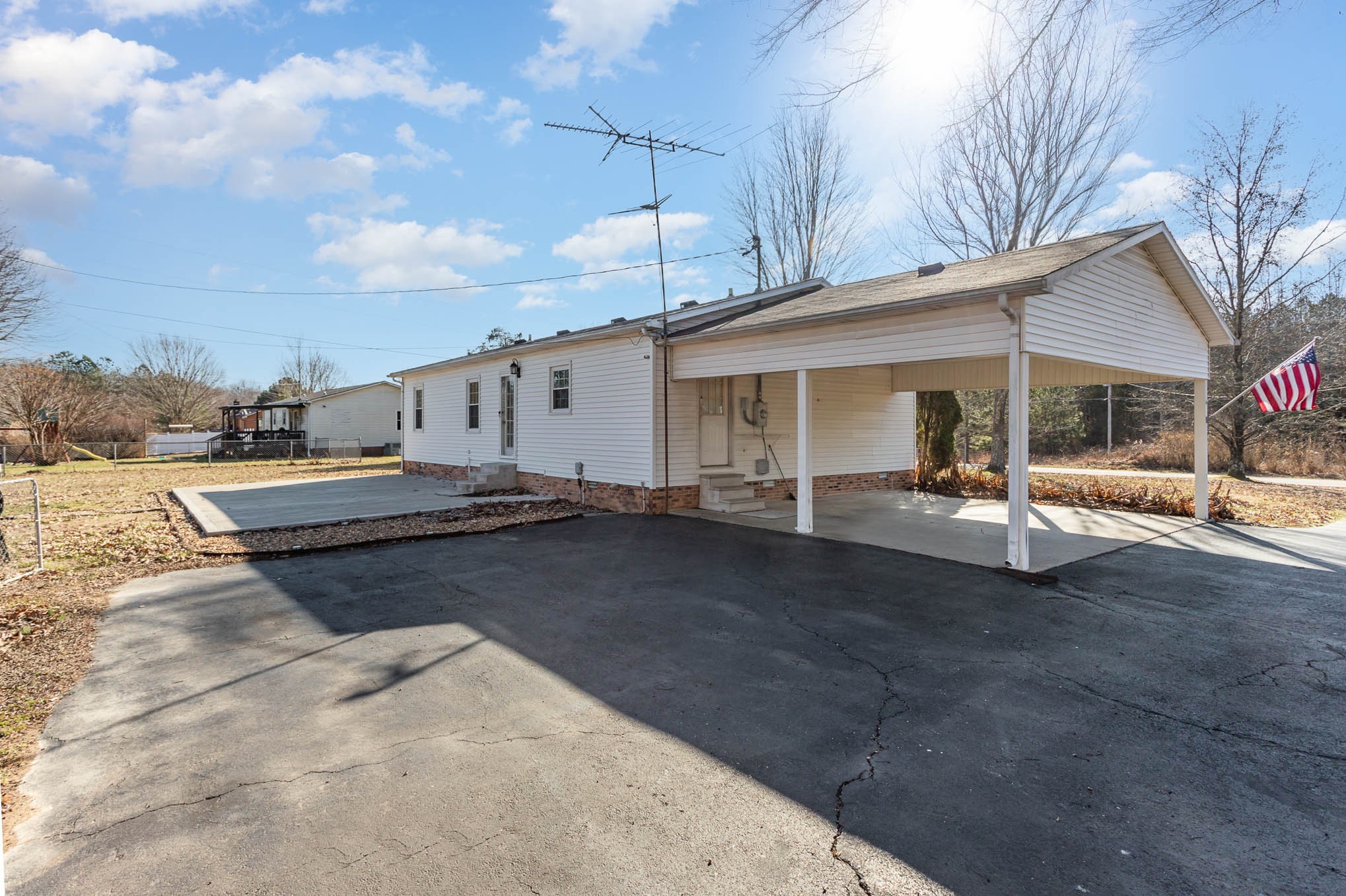 1035 Garton Road Burns, TN 37029 - Photo 31 of 31 a view of a white house next to a yard with road