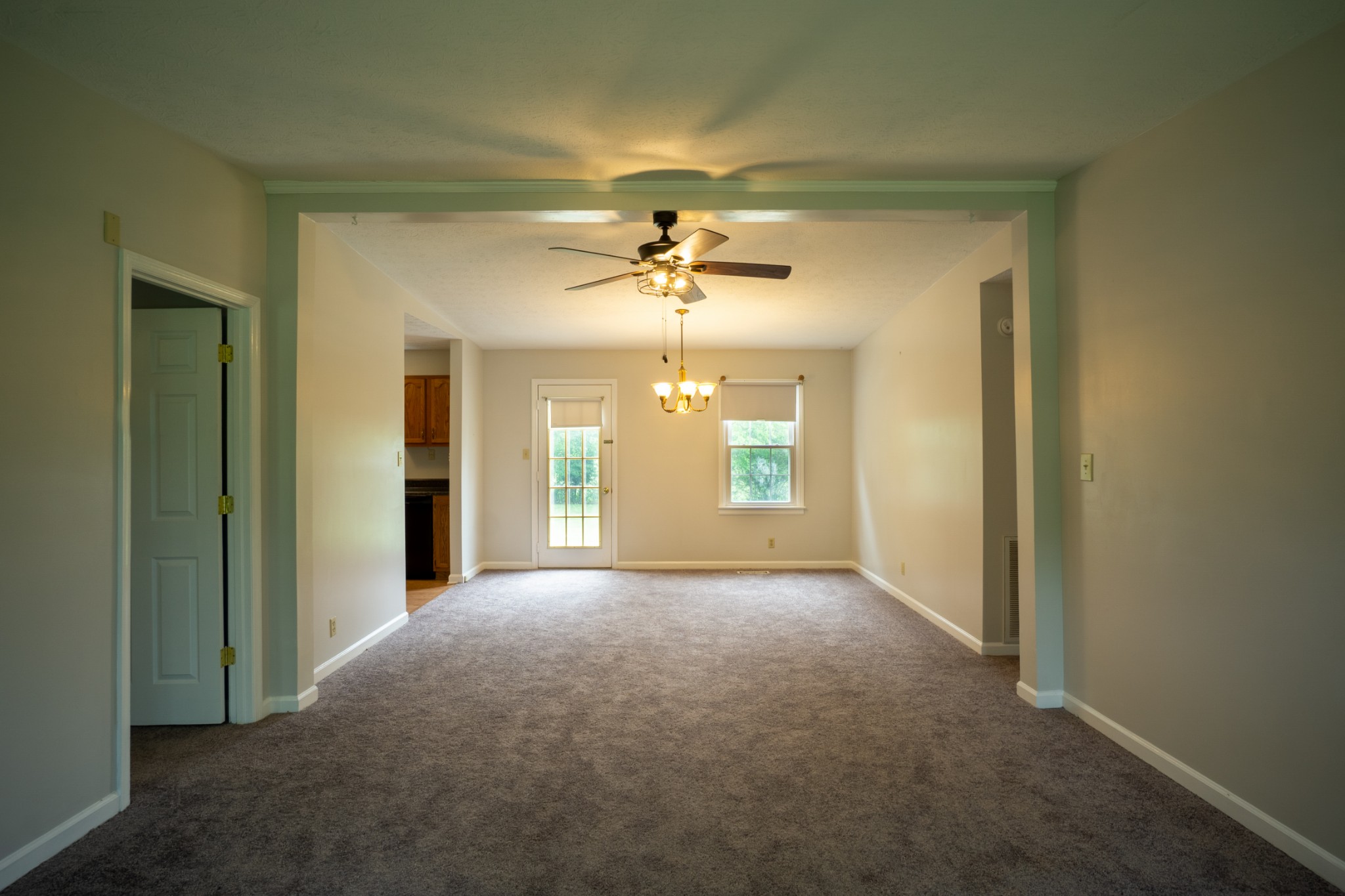 1035 Garton Road Burns, TN 37029 - Photo 4 of 31 an empty room with windows and ceiling fan