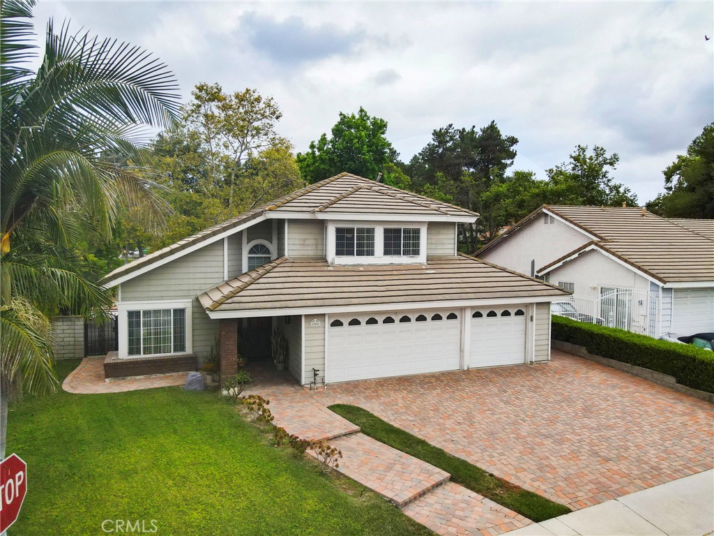 605 Bronco Way Walnut, CA 91789 - Photo 62 of 69 a front view of a house with a garden and plants