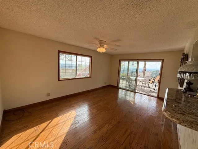 a view of a room with wooden floor