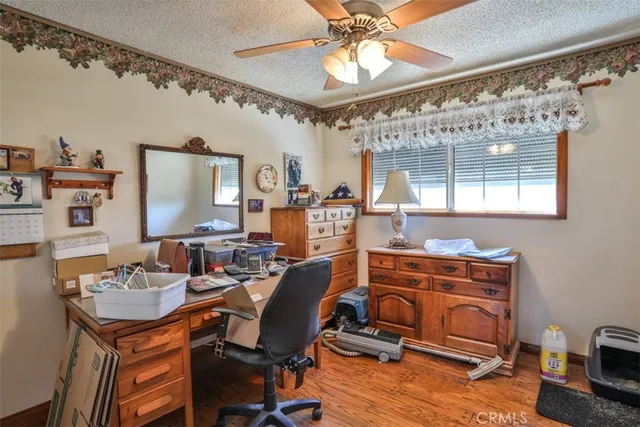 a view of a livingroom with furniture and workspace