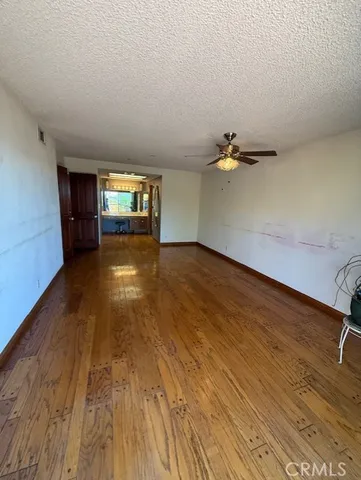 a view of a backyard with table and chairs