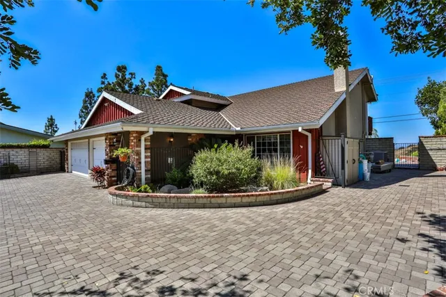a kitchen with stainless steel appliances granite countertop a sink a stove and a wooden floors