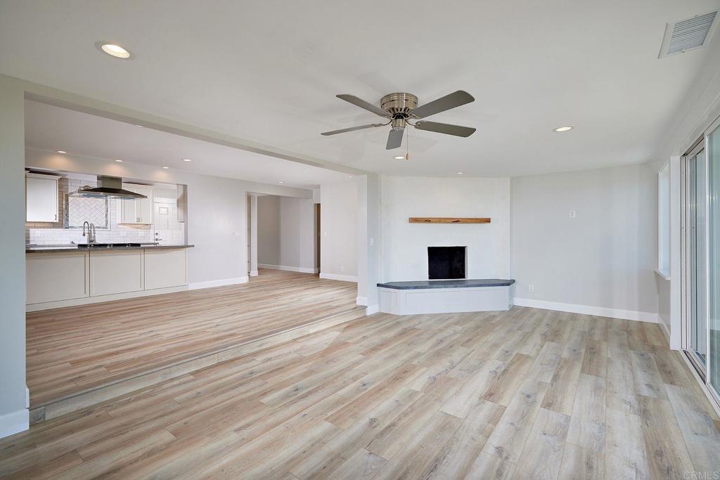 717 Barbara Avenue Solana Beach, CA 92075 - Photo 23 of 40 a view of empty room with wooden floor and window