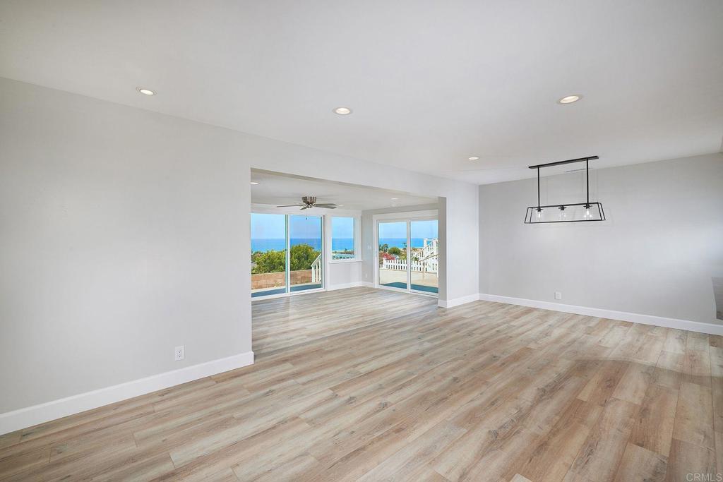 717 Barbara Avenue Solana Beach, CA 92075 - Photo 24 of 40 a view of an empty room with wooden floor and a window