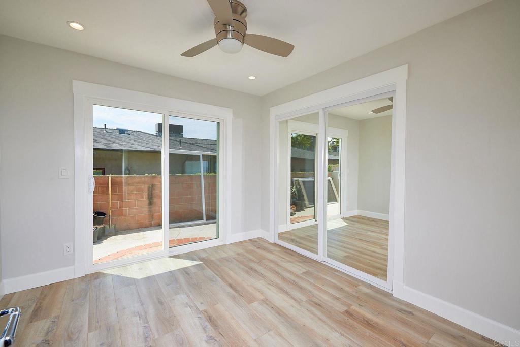 717 Barbara Avenue Solana Beach, CA 92075 - Photo 34 of 40 a view of an empty room with wooden floor and a window