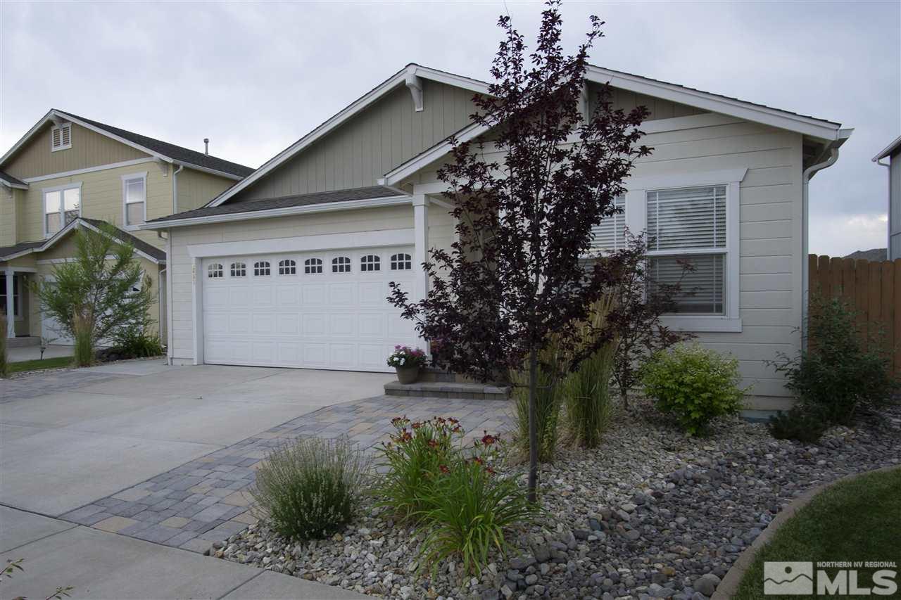 7692 Corso Street Reno, NV 89506 - Photo 3 of 23 a front view of a house with garden