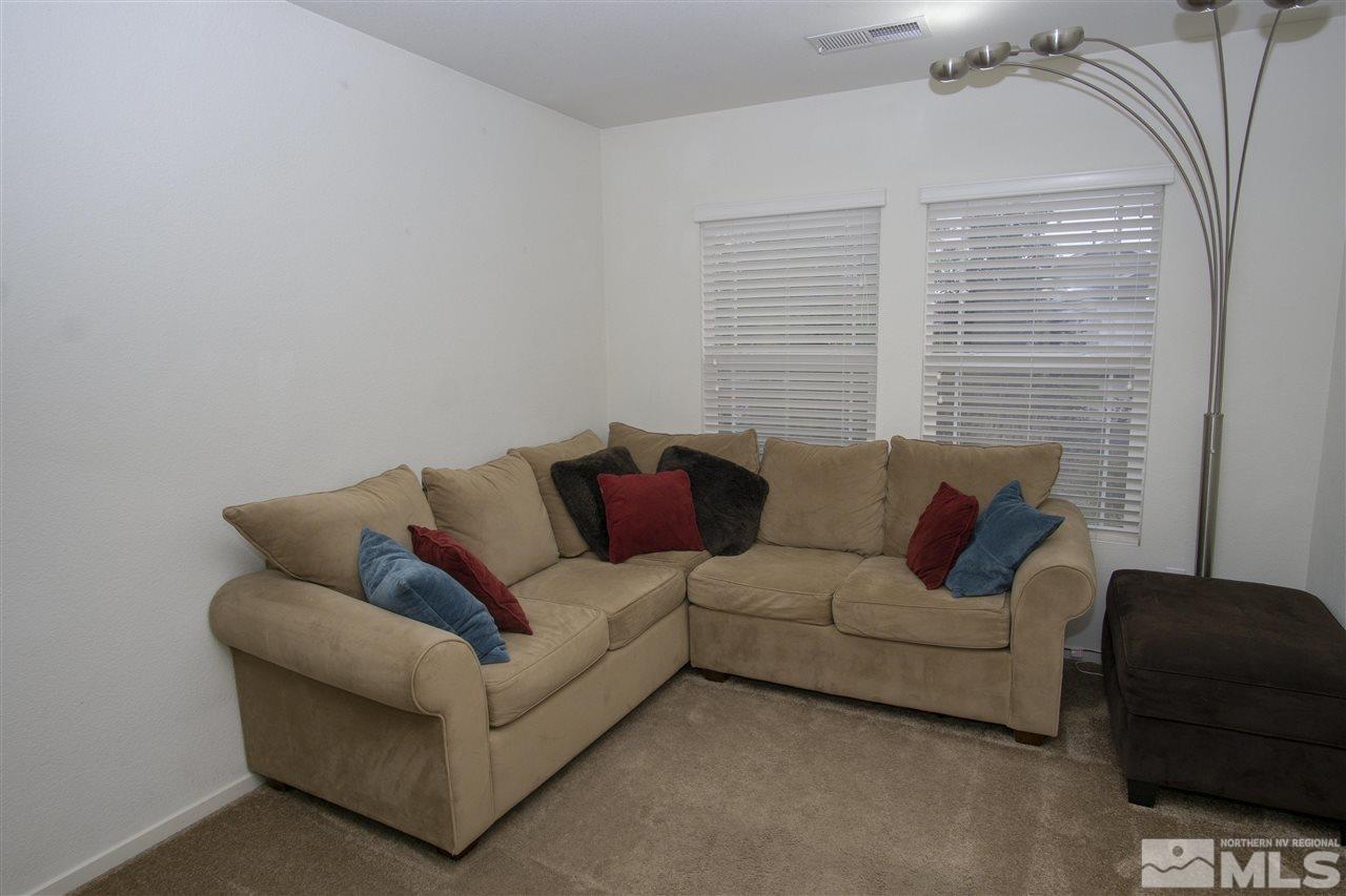 7692 Corso Street Reno, NV 89506 - Photo 4 of 23 a living room with furniture and a couch