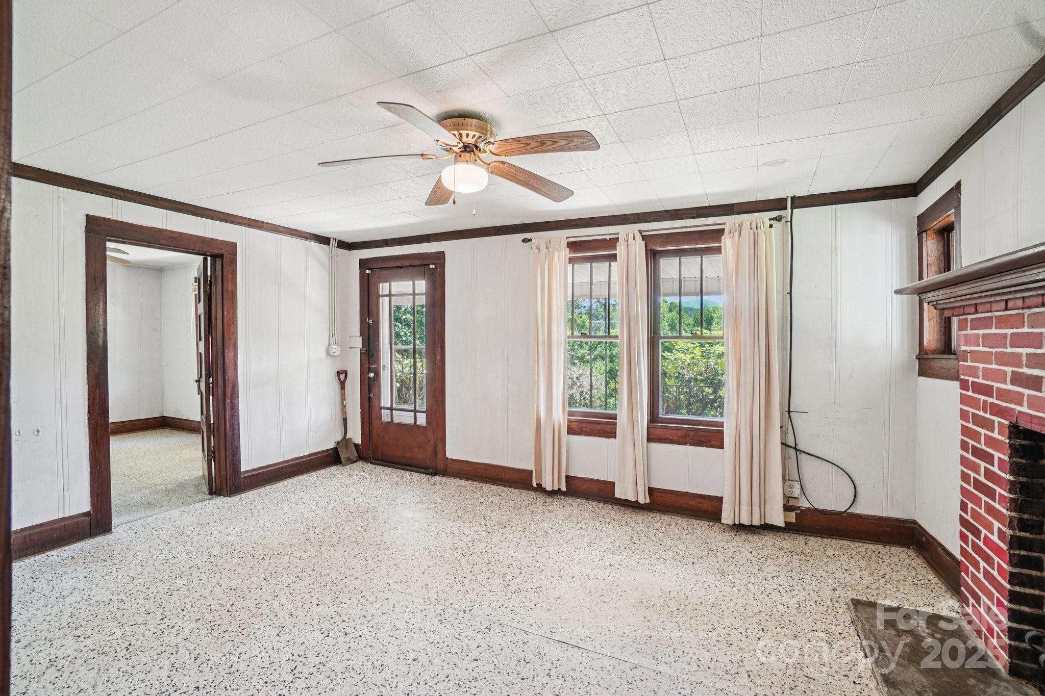 203 North Beaverdam Road Candler, NC 28715 - Photo 12 of 40 a view of a livingroom with a staircase