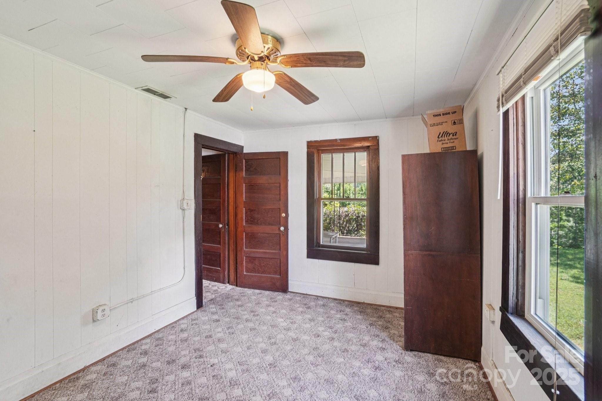 203 North Beaverdam Road Candler, NC 28715 - Photo 14 of 40 an empty room with windows and closet