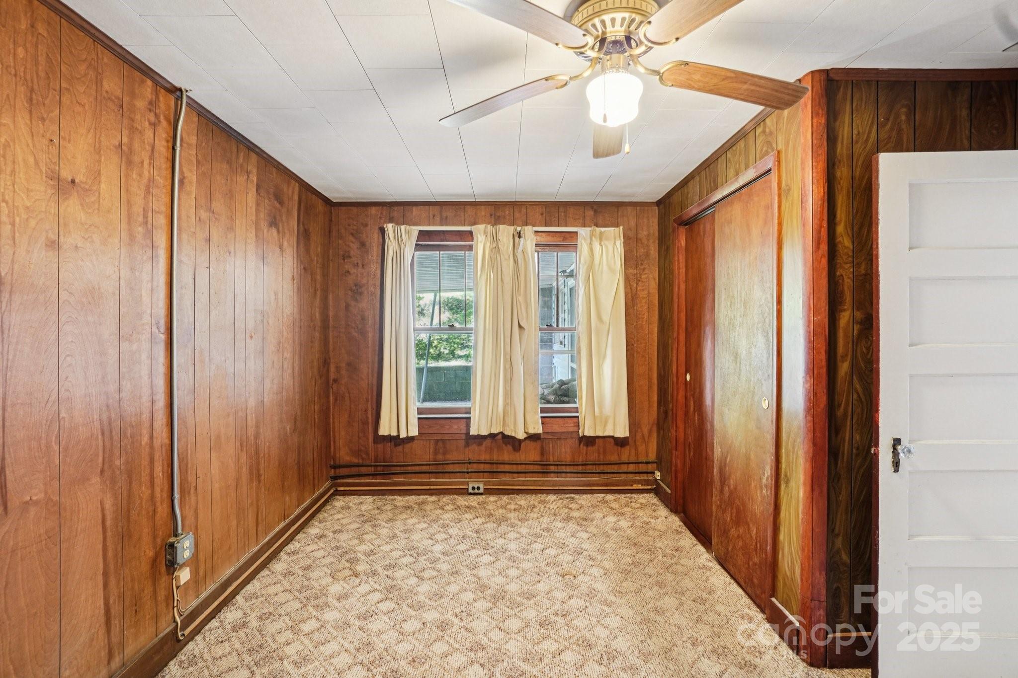 203 North Beaverdam Road Candler, NC 28715 - Photo 16 of 40 wooden floor in an empty room with a window