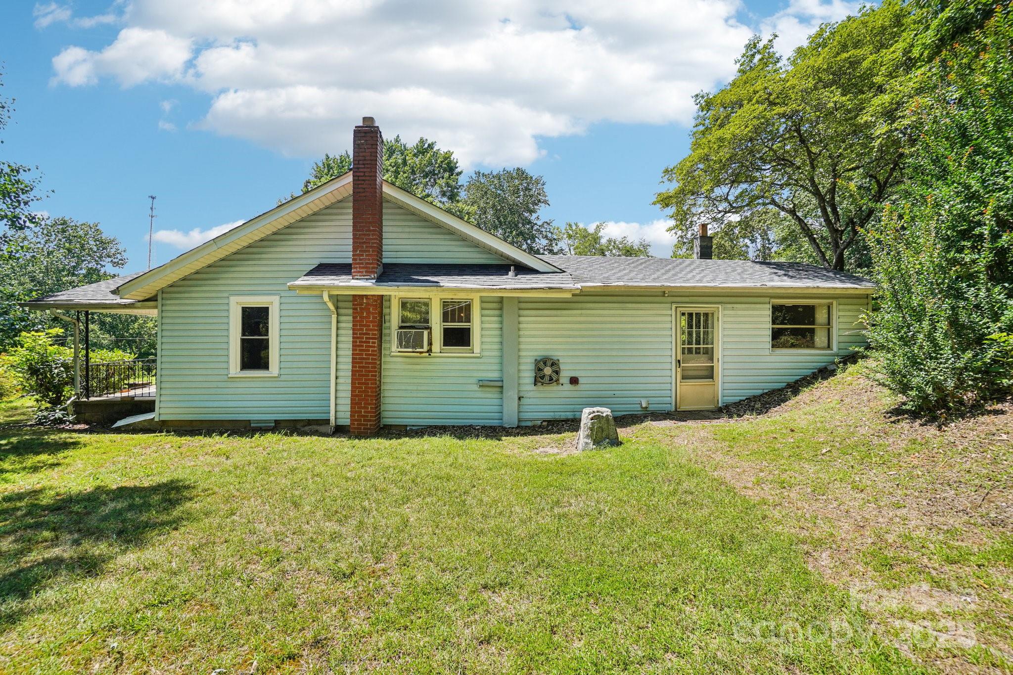 203 North Beaverdam Road Candler, NC 28715 - Photo 25 of 40 a view of a house with a yard