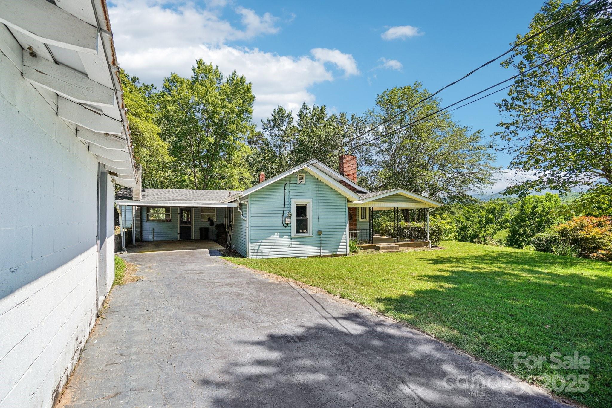203 North Beaverdam Road Candler, NC 28715 - Photo 26 of 40 a house view with a outdoor space