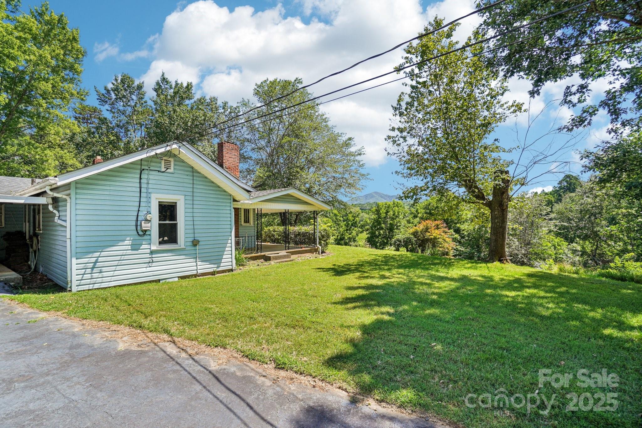 203 North Beaverdam Road Candler, NC 28715 - Photo 27 of 40 a view of a house with a yard