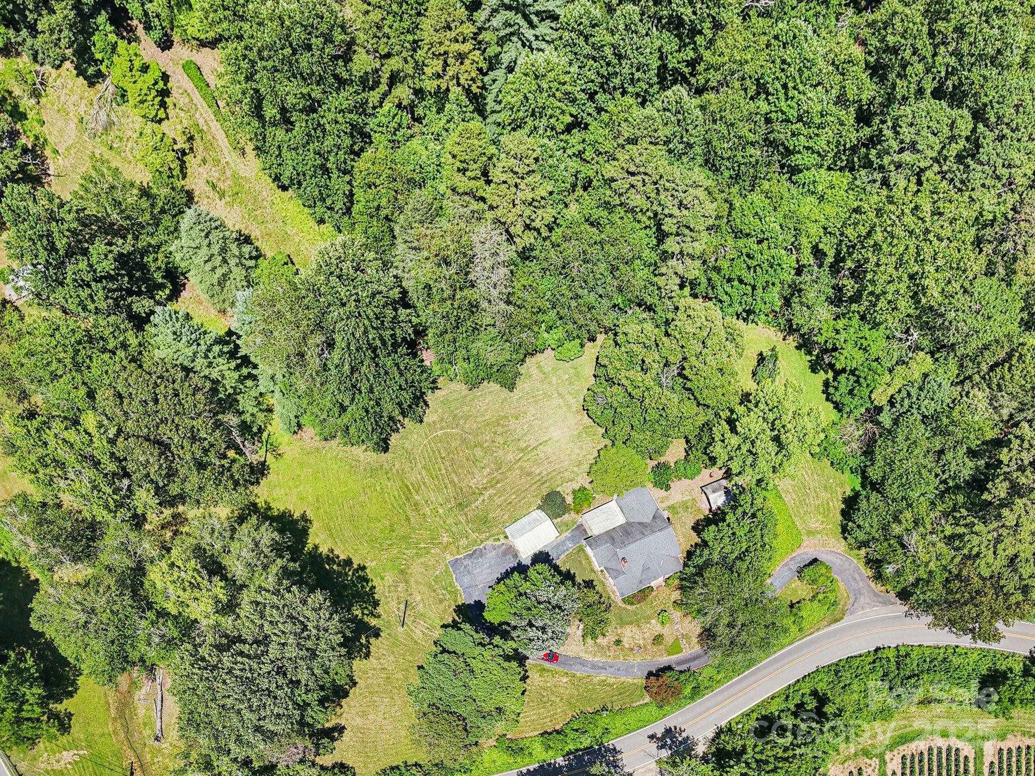 203 North Beaverdam Road Candler, NC 28715 - Photo 34 of 40 a view of a lake with a yard