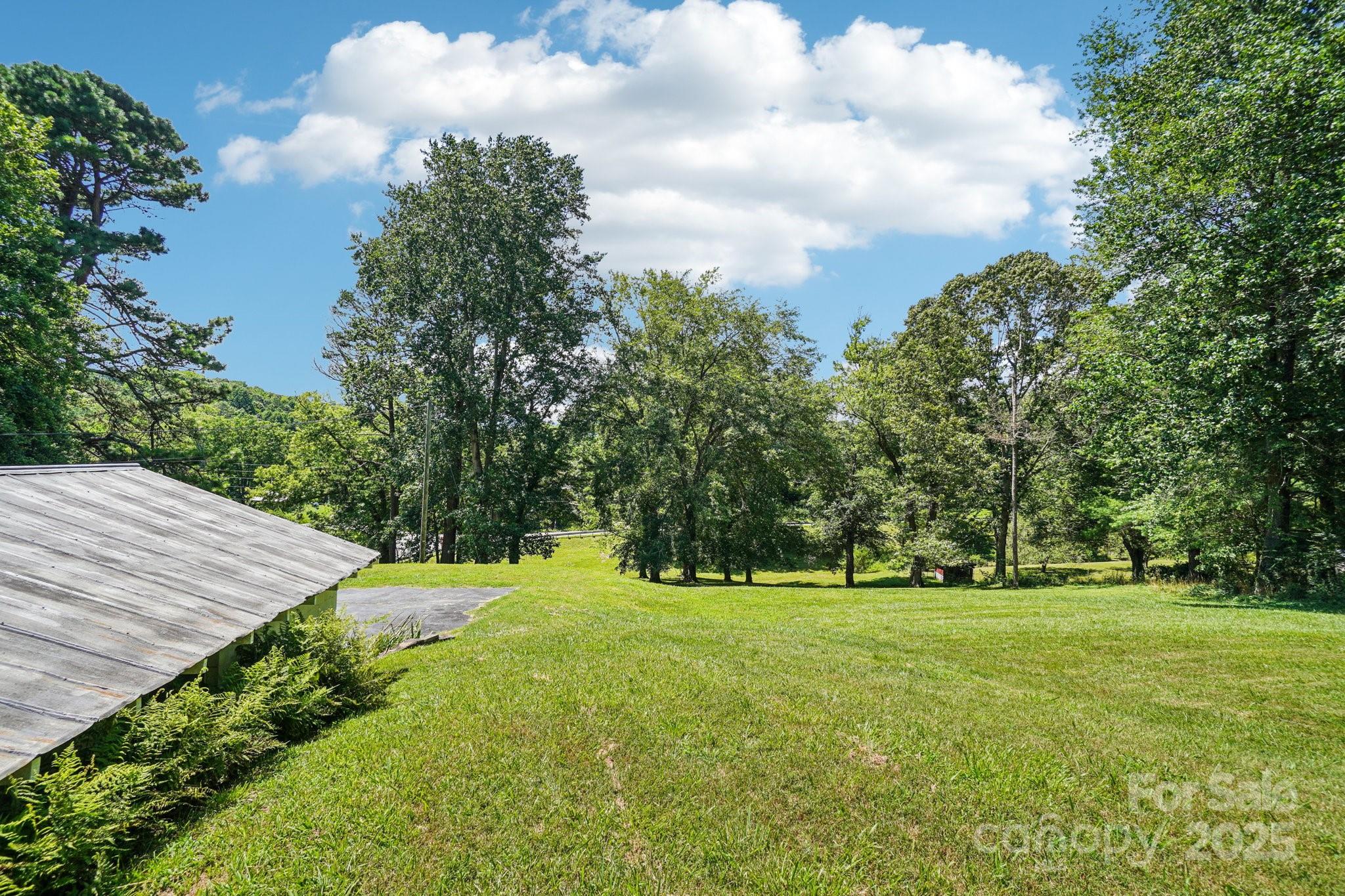 203 North Beaverdam Road Candler, NC 28715 - Photo 37 of 40 a view of a golf course with a trees