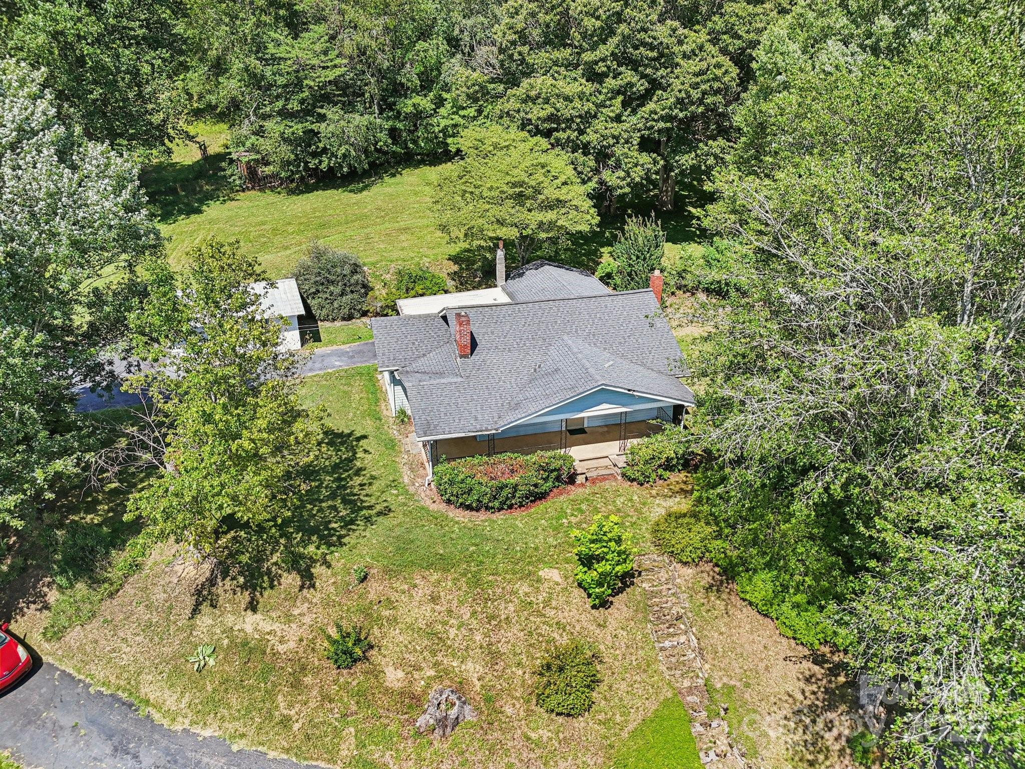 203 North Beaverdam Road Candler, NC 28715 - Photo 39 of 40 an aerial view of a house with a yard