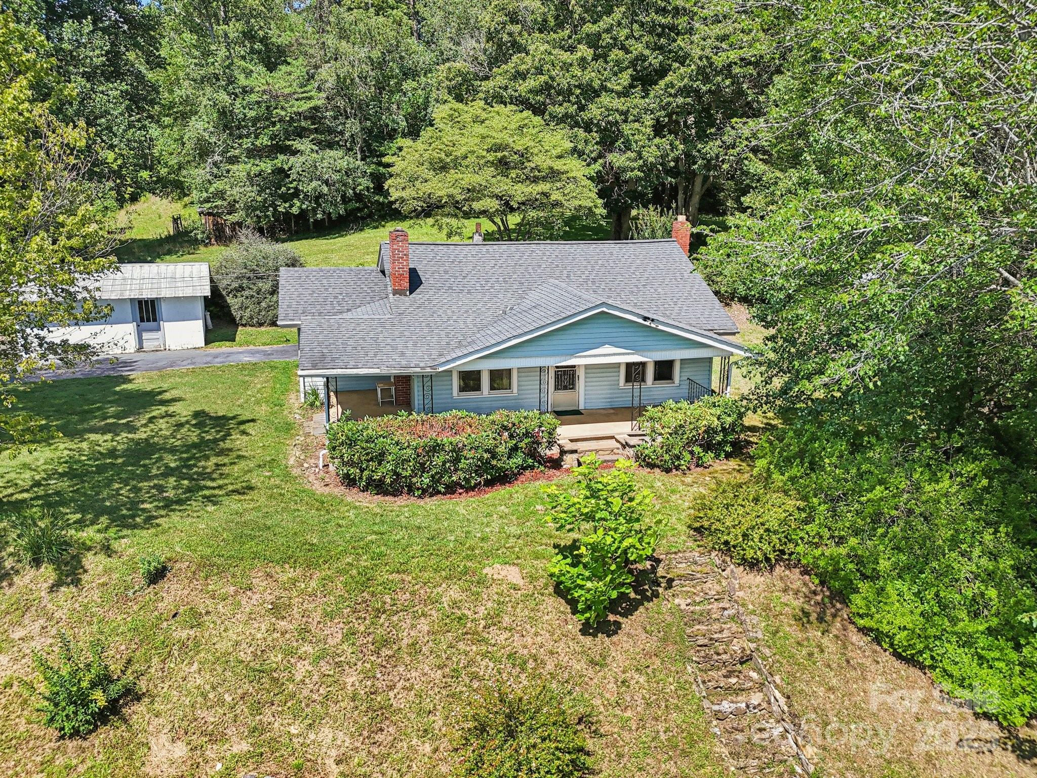 203 North Beaverdam Road Candler, NC 28715 - Photo 5 of 40 a aerial view of a house with yard and green space