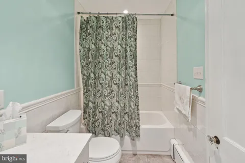 a bathroom with a toilet and shower