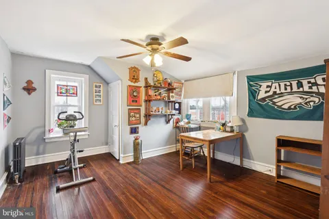 a work room with furniture and wooden floor