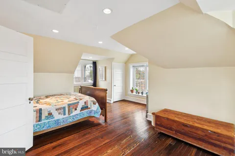 a bedroom with bed and window