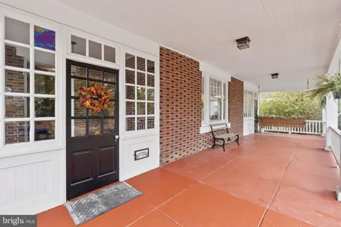 a bed room with a bed and a large window