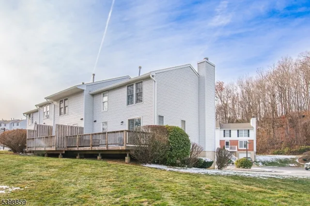 a swimming pool view with a outdoor seating space