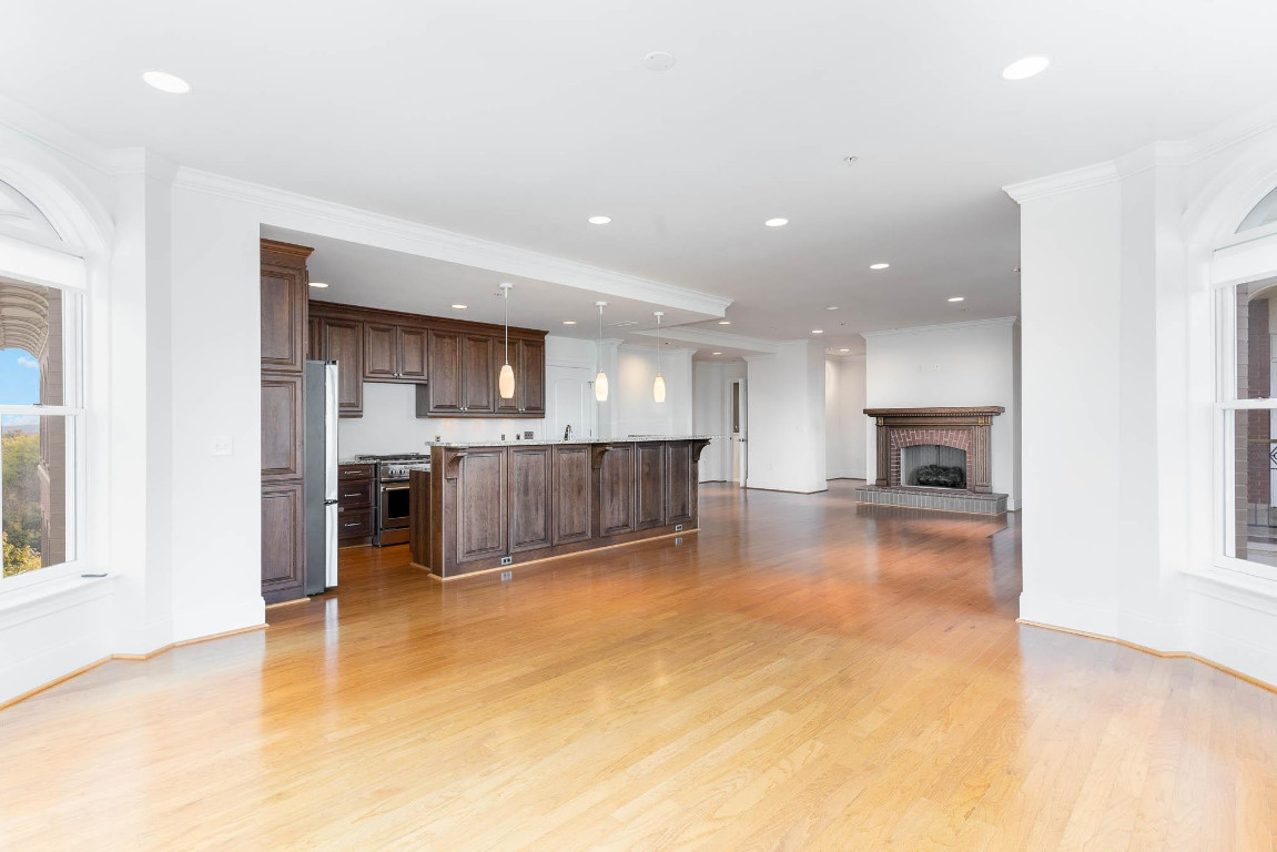 710 Independence Place, Unit 606 Raleigh, NC 27603 - Photo 11 of 21 a view of a kitchen and kitchen with a sink cabinets and a floor to ceiling window