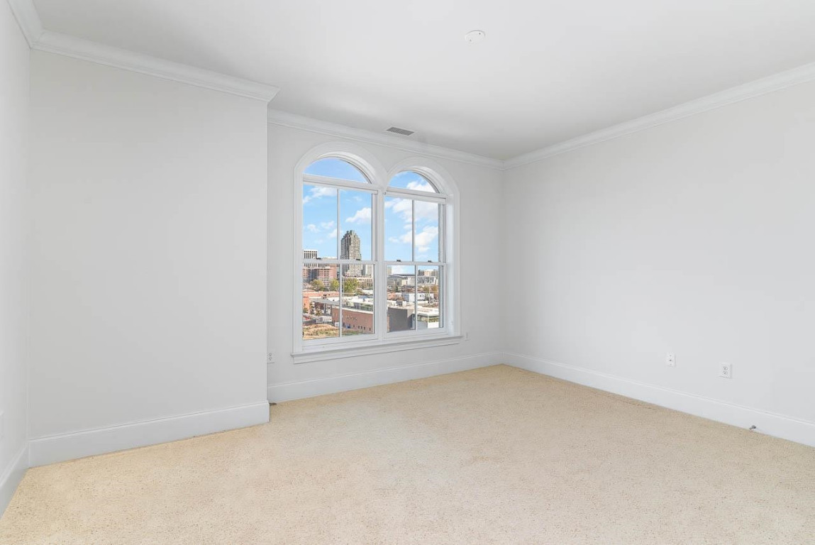 710 Independence Place, Unit 606 Raleigh, NC 27603 - Photo 16 of 21 an empty room with a empty space and window