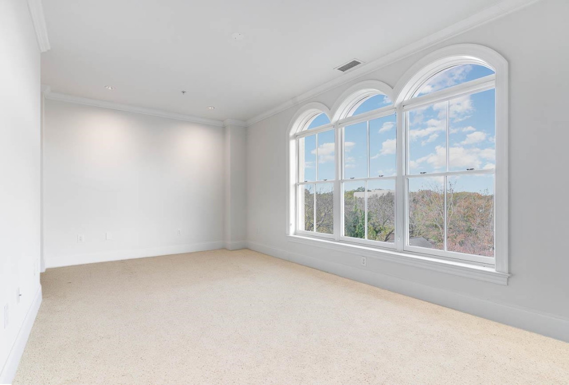 710 Independence Place, Unit 606 Raleigh, NC 27603 - Photo 17 of 21 an empty room with a window