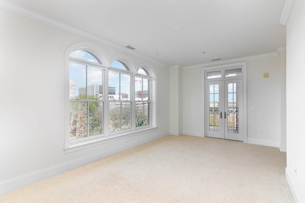 710 Independence Place, Unit 606 Raleigh, NC 27603 - Photo 19 of 21 a view of an empty room with glass door