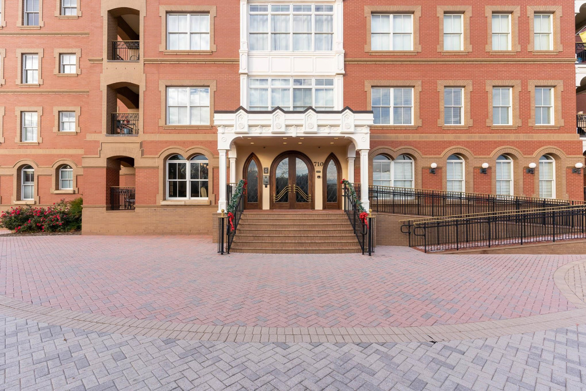 710 Independence Place, Unit 606 Raleigh, NC 27603 - Photo 20 of 21 a view of building with glass windows