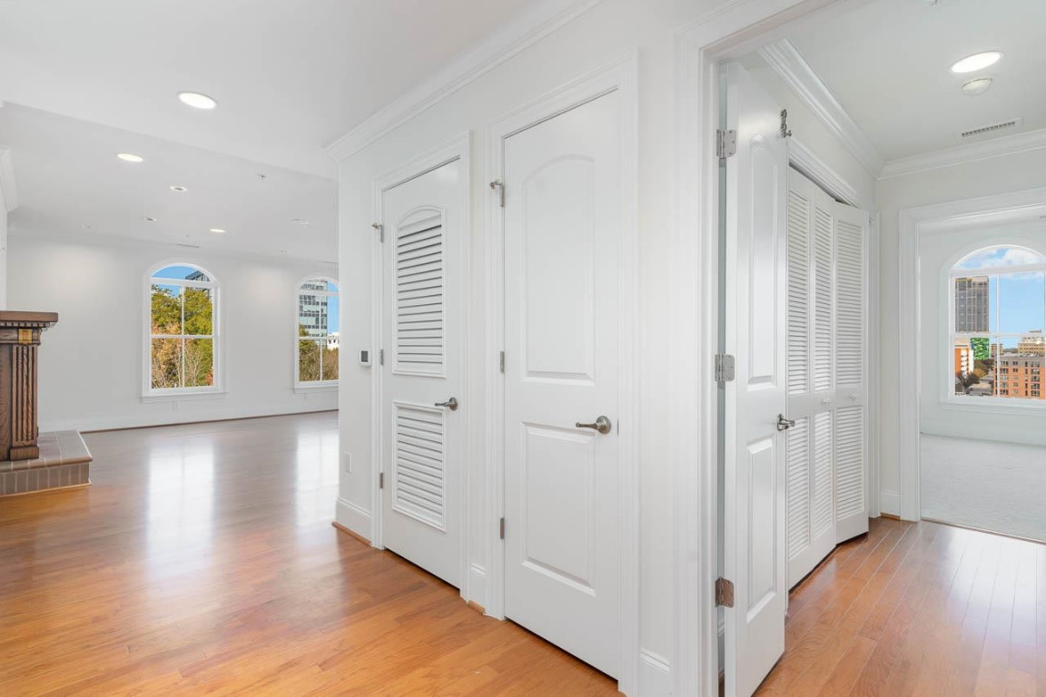 710 Independence Place, Unit 606 Raleigh, NC 27603 - Photo 7 of 21 wooden floor in an empty room with a window