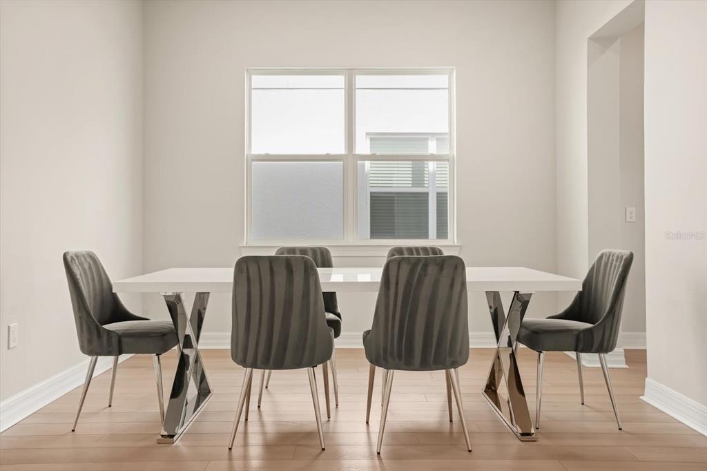 8352 Pk Clf Way Orlando, FL 32836 - Photo 13 of 55 a view of a dining room with furniture and window
