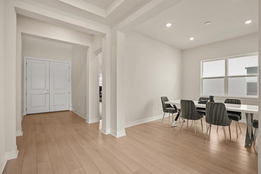 8352 Pk Clf Way Orlando, FL 32836 - Photo 14 of 55 a view of a dining room with furniture and wooden floor