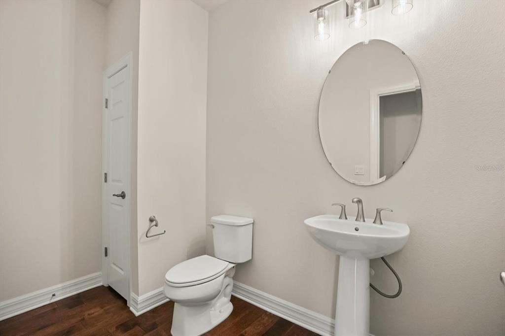 8352 Pk Clf Way Orlando, FL 32836 - Photo 15 of 55 a bathroom with a toilet sink and mirror