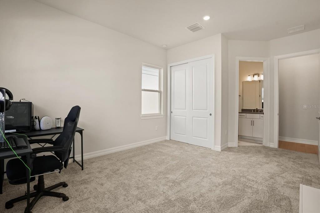 8352 Pk Clf Way Orlando, FL 32836 - Photo 18 of 55 a view of a workspace with furniture and a window