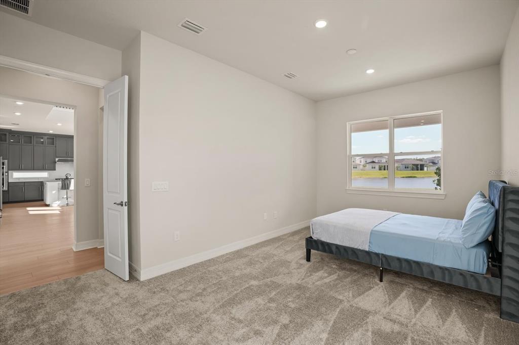 8352 Pk Clf Way Orlando, FL 32836 - Photo 20 of 55 a spacious bedroom with a bed and a window